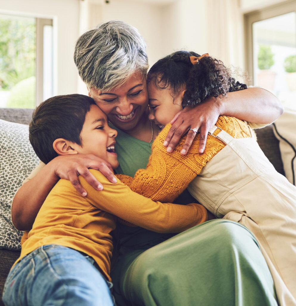 Family hugging and laughing together